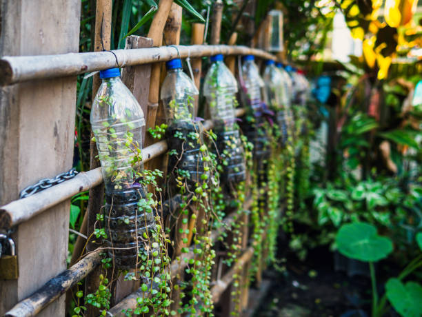 istock Creative ideas for making plant holders from recycled plastic bottles. These can be used to decorate your garden or home while reducing packaging waste. 2112086972