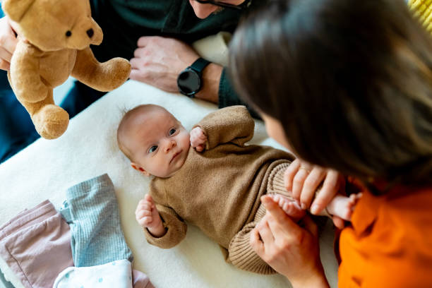 istock Family in bedroom with child 2112092549