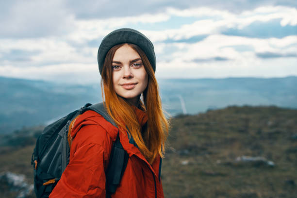 istock mountains landscape woman vacation adventure backpack tourism model 2112096940