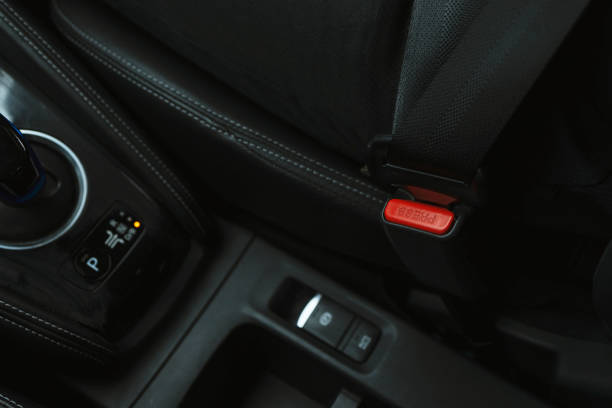 istock Close-up hand man driver fastens seat belt. 2112143565