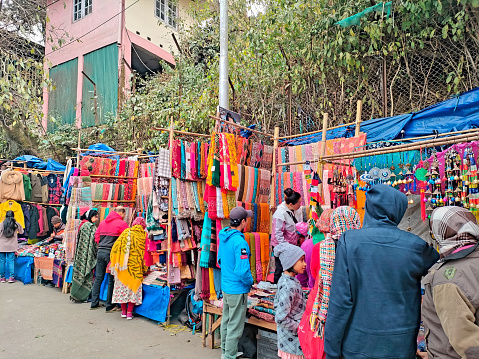 Darjeeling West Bengal India 19.03.2024.tourists visiting the local street market at afternoon in Darjeeling Mahakal Market India
