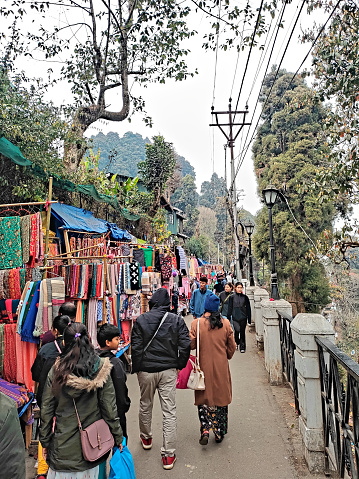 Darjeeling West Bengal India 19.03.2024. tourists visiting the local street market at afternoon in Darjeeling Mahakal Market India