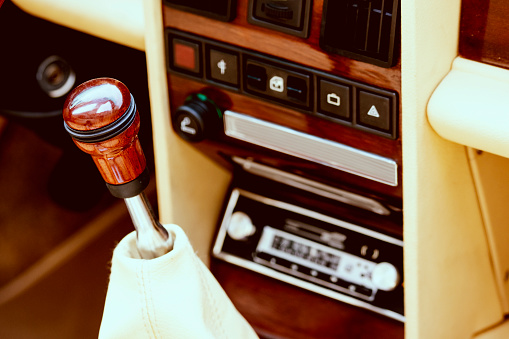 Luxurious car equipment in an elegant and old fashion style. Old car stereo radio.