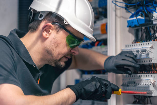 istock A male electrician works in a switchboard using an electrical connection cable. 2112258379