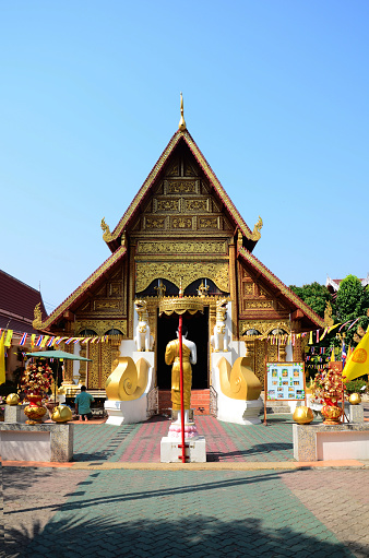 Ancient antique Ubosot Wihan Kaew for thai travelers people travel visit respect praying blessing buddha wish holy at Wat Phra Singh or Phra Sing temple on February 24, 2015 in Chiang Rai, Thailand