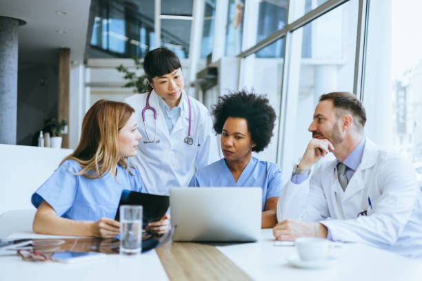 istock Doctors in a collaborative medical meeting 2112296326