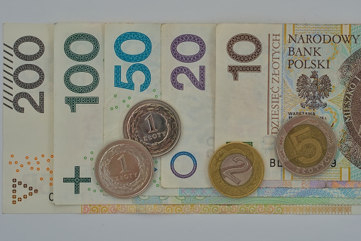 polish zloty bank notes and coins sorted from 200 to 10 overhead shot