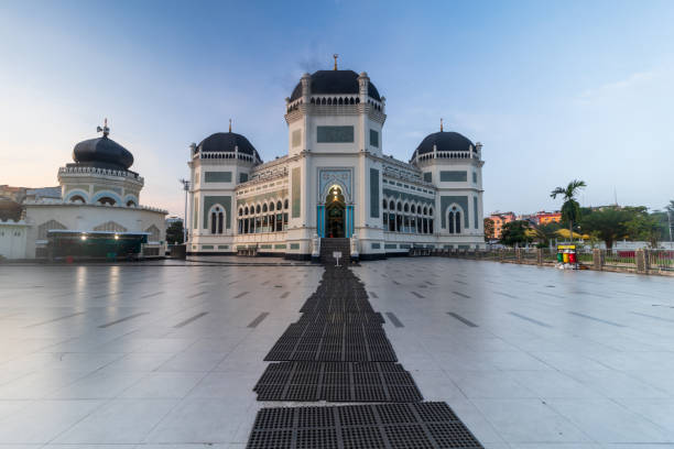 istock Al Mashun Grand Mosque with blue sky background 2112351700