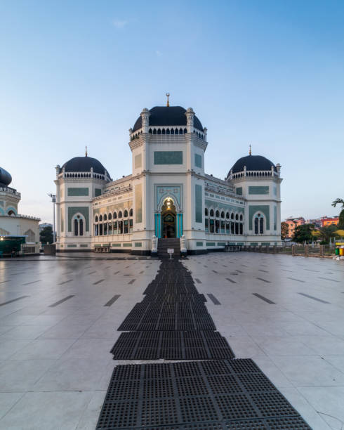 istock Al Mashun Grand Mosque with blue sky background 2112351985