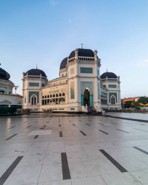 istock Al Mashun Grand Mosque with blue sky background 2112352300