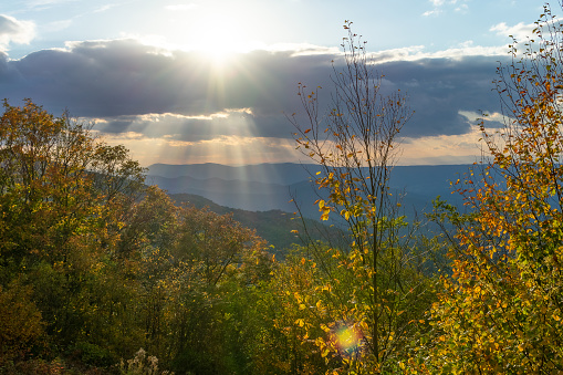 Sun shining down on Blue Ridge Mountains in the Fall near Shenandoah National Park as seen from Skyline Drive in Virginia
