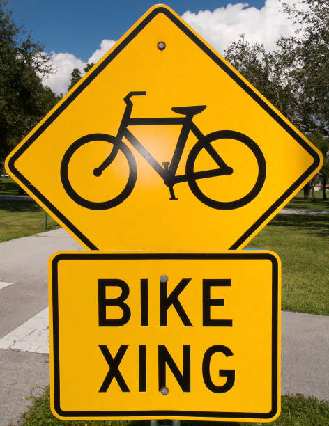 istock this is a road sign with a bicycle crossing sign attached to it 2112371314