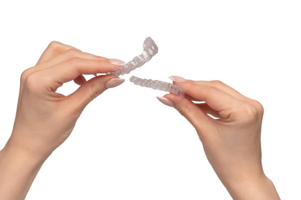 istock Transparent mouth guard in a woman's hand isolated. 2112386072