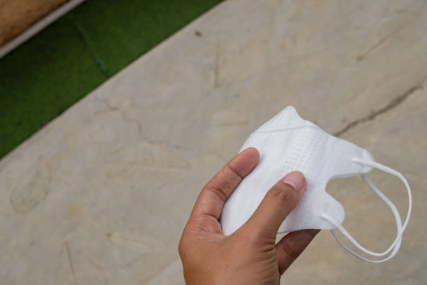 istock White face mask over the floor. 2112386680