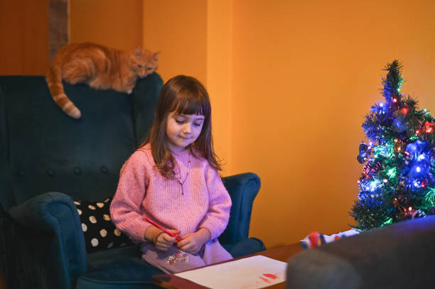 istock Little girl drawing an image for Christmas. 2112395866