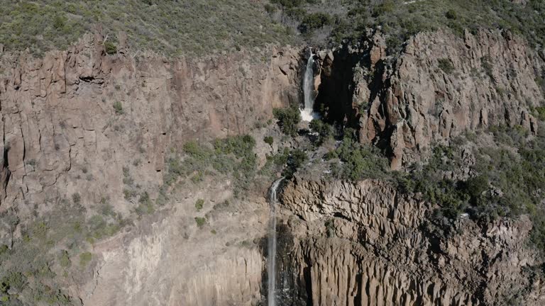 Rising drone shot of a rare waterfall in Sedona, Arizona.