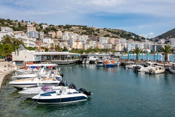 istock Small boats moored in Saranda Habrour 2112445863