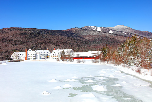 The covered bridge above High Falls in DuPont State Forest after a snow and ice storm.