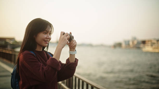 istock Girl taking a photo while traveling. 2112484920