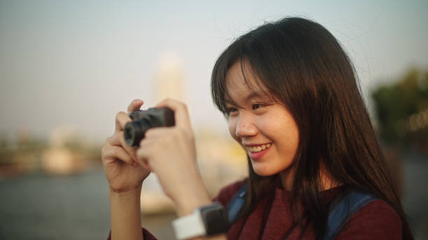 istock Girl taking a photo while traveling. 2112485272