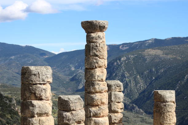 The archeological site Delphi in Greece is located on multiple terraces with supporting stone walls along the slope of Mount Parnassus. The ancient Greeks considered Delphi to be the centre of the world and marked the place with a stone monument, a navel (omphalos). Delphi was the home of oracles that were consulted before important decisions were made. The sacred precinct is situated at the south-western slope of Mount Parnassus and is recognised by UNESCO as a World Heritage Site. The image was captured with a full frame DSLR camera and a sharp lens at low ISO and is part of a series of photographs of Delphi.