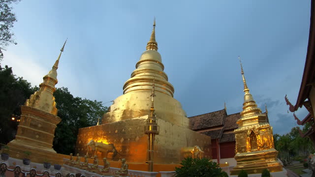Twilight show of Wat Phra Singh Woramahawihan shot in slow motion