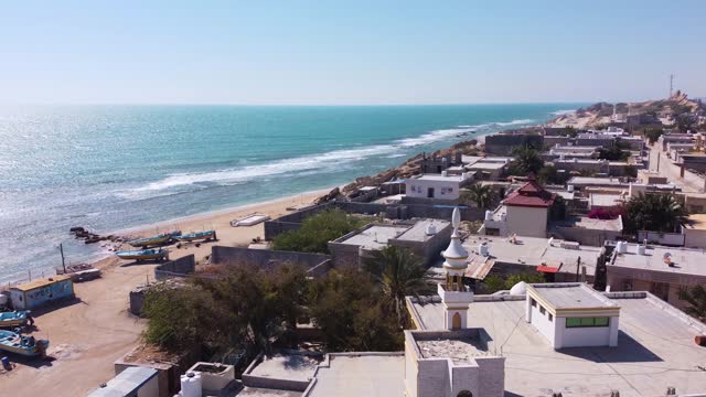 aerial shot on tropical city landscape the seaside town coastal rural village countryside beach bungalow cottage in summer season in tourist destination in Saudi travel guide Islamic local community