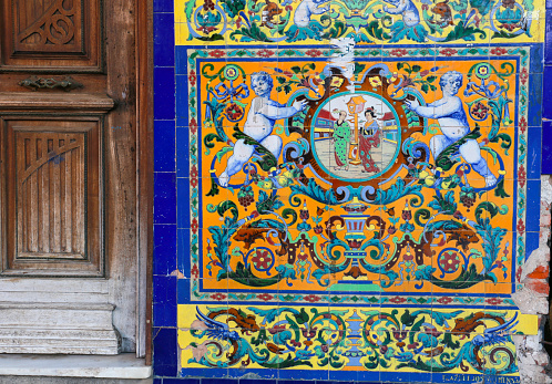 Merida, Extremadura, Spain- October 23, 2023: Colorful tiles on facade of building in the old town of Merida