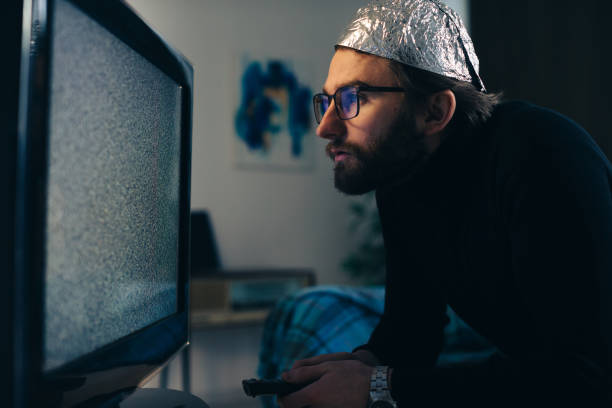 Foil Defense Against Influence: Viewing TV Interference through the Lens of a Conspiracy Theorist Foil Defense Against Influence: Viewing TV Interference through the Lens of a Conspiracy Theorist tinfoil barb barbonymus schwanenfeldii stock pictures, royalty-free photos & images