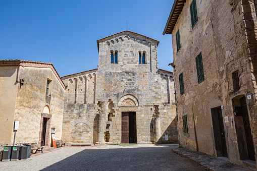 Cityscape. Medieval village in Tuscany - The Abbey of Santi Salvatore e Cirino (italian Abbadia a Isola), central Italy, near Monteriggioni, province of Siena, Italy
