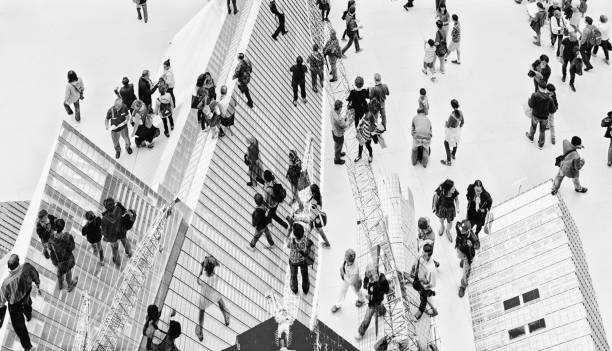 istock Abstract image of people climbing on a tower. 2112677289