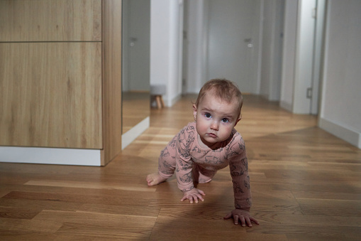 Little baby crawling during the night.