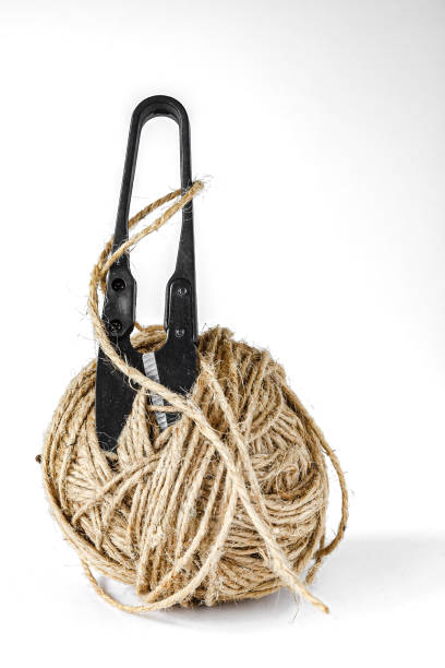 istock Scissors and a ball of twine 2112709450