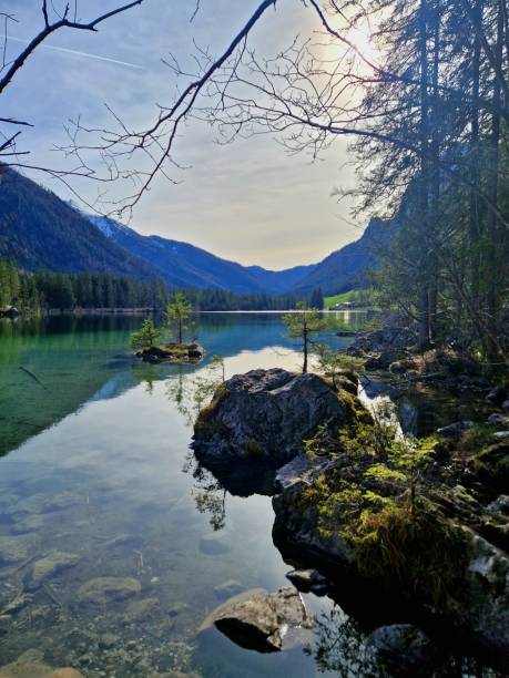istock lake Hintersee in Bavaria - stones in water 2112732296