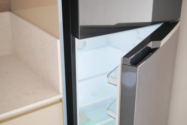 istock half open fridge with food and vegetables , 2112743179