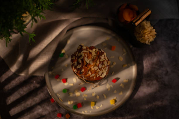 istock Top view of a plate of Easter crafin. Happy Easter holiday. Easter cupcake on dark background 2112743716