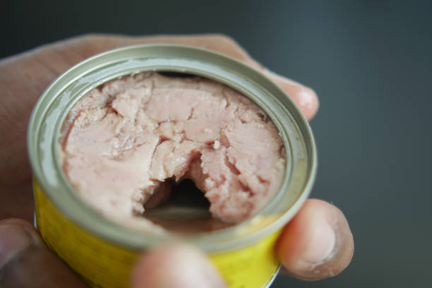 canned tuna on wooden table