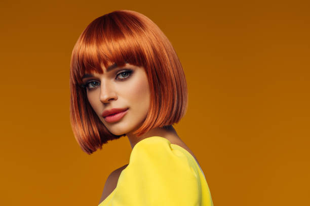 istock Beautiful woman on a yellow background 2112749004