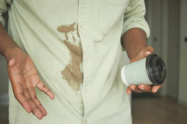 istock men hands with spilled coffee over his shirt 2112758550