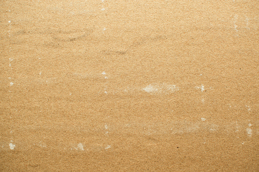 Horizontal image of a cardboard paper ideal for light brown textures