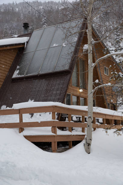 istock Winter Cabin in the Mountains 2112811871