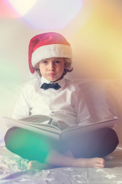 Santa Claus Reading a Book by a Christmas Tree
