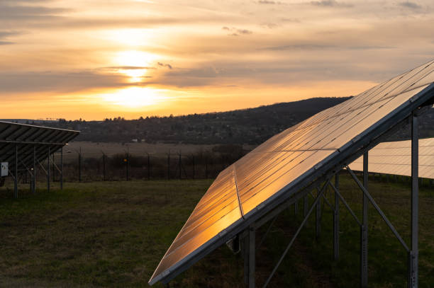 istock Solar panels in a solar power station at sunset 2112869557
