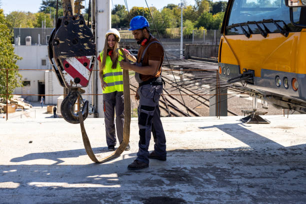 istock A Multicultural Couple of Construction Workers is Working at a Construction Site. 2112879690