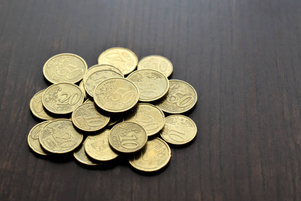 Euro cent coins money on wood table.