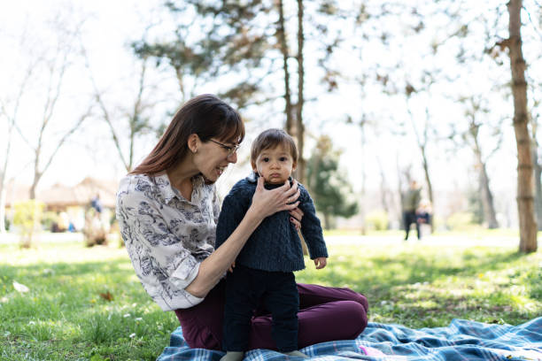 istock Mother playing with her baby 2112888899