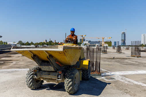 Yellow Modern Three-Axle Road Grader Isolated on a White Background