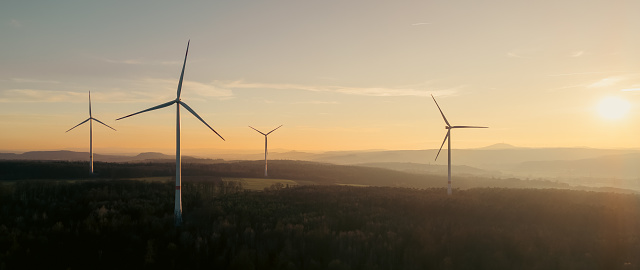 Wind turbines generating renewable energy under the sun