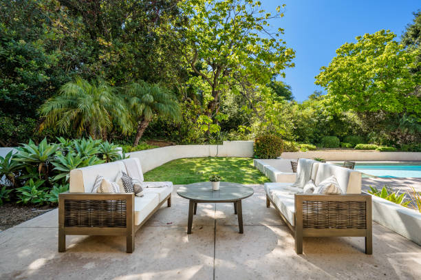 istock patio area with a firepit and lawn areas near the pool 2112938847