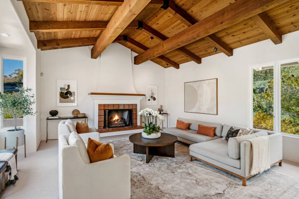 istock an open living area has a wood paneled ceiling and white couches 2112939876